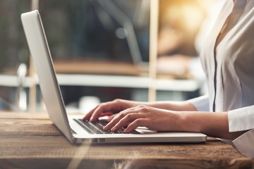 Woman typing computer.