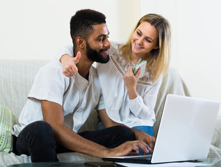 young interracial couple with notes