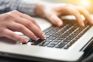 Woman working on laptop.