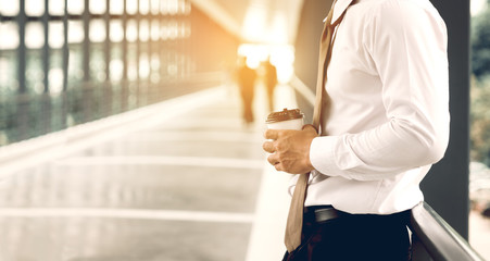 Businessman standing at building walkway company with hope concept.