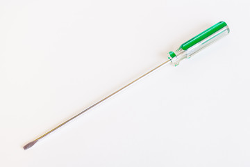 Fototapeta premium Screwdriver with a long rod. Transparent green handle screwdriver with flat tip