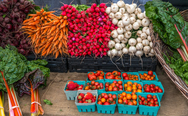 Colorful organic vegetables on display at farmers market.