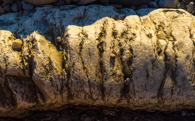 boulders and colorful pebbles on the beach