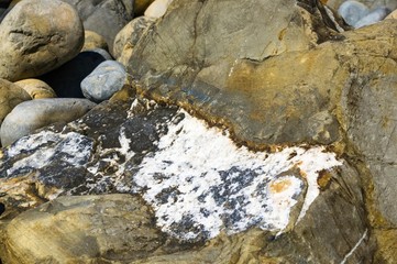 boulders and colorful pebbles on the beach