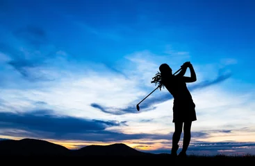 Poster silhouette golfer playing golf during beautiful sunset © Satit _Srihin