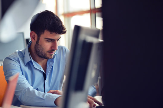 Freelance programmer working in startup office