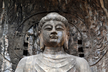 Fototapeta na wymiar The main Buddha Statue around Longmen Grottoes on the hill. Pic was taken in September 2017