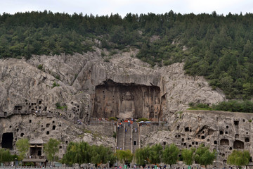 Tourist visiting Longmen Grottoes, that's famous for its thousands of holes filled by Buddha statues. Pic was taken in September 2017