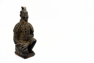 Terracotta warrior on white background with copy space.