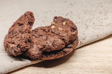 Pastry biscuits on linen napkin on wooden table