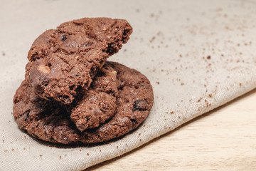 Pastry biscuits on linen napkin on wooden table