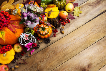 Thanksgiving arrangement with clover, apples, pumpkins, copy space
