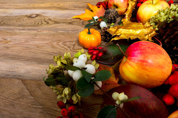 Thanksgiving background with apples, barberry and white berries