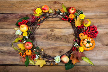 Thanksgiving door wreath with pumpkins and yellow roses