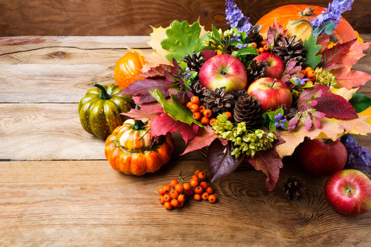 Thanksgiving greeting background with ripe apples, blue flowers