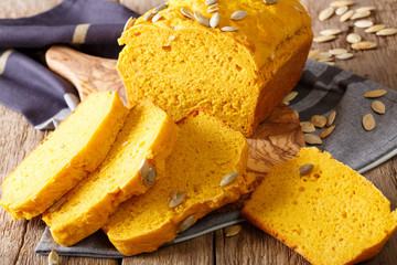 Freshly baked pumpkin bread with seeds close-up on the table. horizontal
