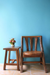 interior design of wood chair on a blue wall