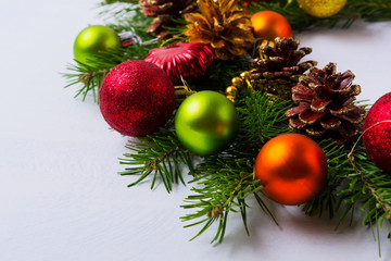 Christmas background with red, orange, green ornaments wreath