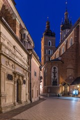 Fototapeta na wymiar Krakow, Poland, Mariacki square between St Mary's church and St Barbara's church in night