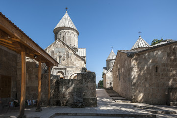 Fototapeta na wymiar Armenia. Inner courtyard of the monastery Haghartsin. Church St. Grigor, Surb Astvatsatsin, Surb Stepanos and the refectory.