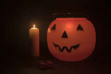 Halloween pumpkins basket and candlelight