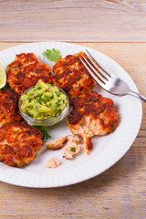 Salmon burgers with avocado salsa. Salmon cakes