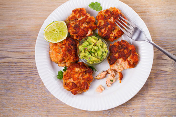 Salmon burgers with avocado salsa. Salmon cakes