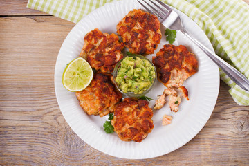 Salmon burgers with avocado salsa. Salmon cakes