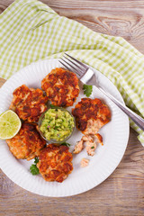 Salmon burgers with avocado salsa. Salmon cakes