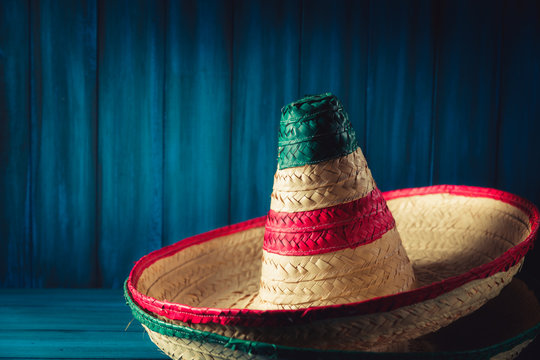 High contrast image of mexican hats on a wooden background