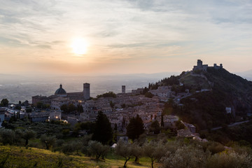 Fototapeta premium Beautiful and unusual view of Assisi town (Umbria, Italy) at sunset