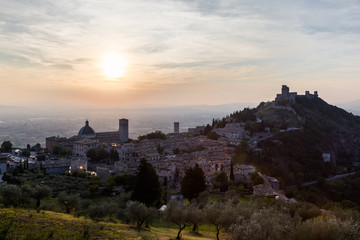 Beautiful and unusual view of Assisi town (Umbria, Italy) at sunset