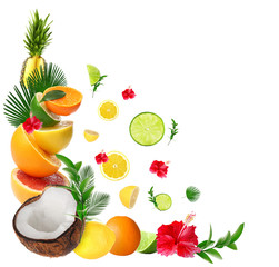 Tropical leaves, sliced fruits and flowers on white background