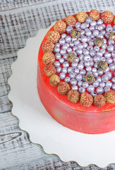 orange cream cheese cake with raspberry, bilberry and blackberry
