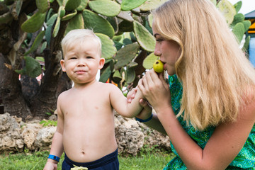 Brother and sister in the park in a summer