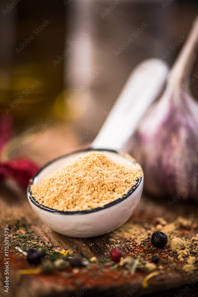 Wall mural Dried ginger powder on spoon