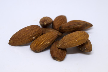 group of almonds on the white background - close up photo
