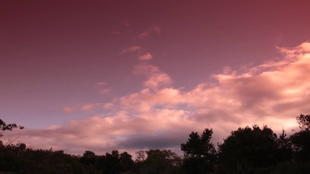 orange clouds moving  in apocalyptic sky filmed in timelapse
