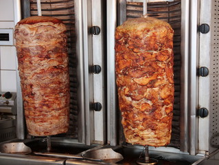 Tratidional greek gyros spits with pork chicken and lamb meat