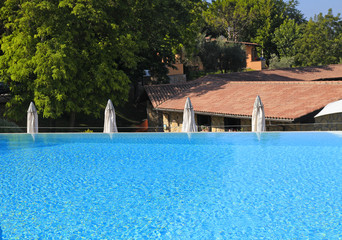 swimming pool on summer resort, Tuscany, Italy