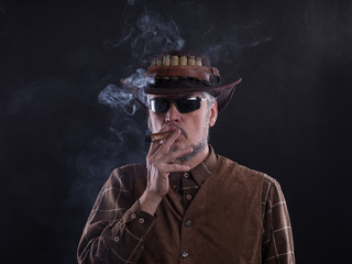 portrait of a cowboy with a cigar