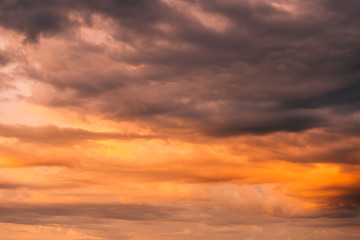 Naklejka na ściany i meble Orange sky, cloud and evening mountains