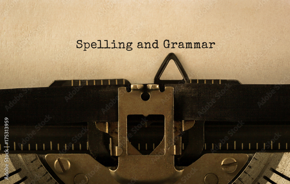 Fototapete text spelling and grammar typed on retro typewriter