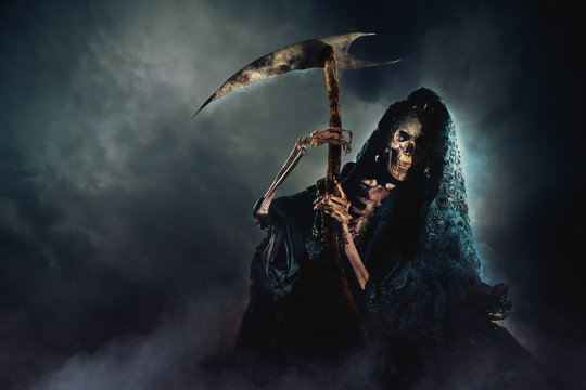 grim reaper with scythe on a smoky background / high contrast image