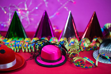 Carnival, background with party hats and streamers
