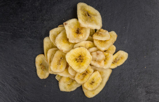 Portion of Dried Banana Chips on a slate slab