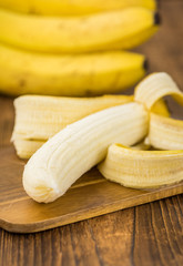 Wooden table with Whole Bananas, selective focus © HandmadePictures