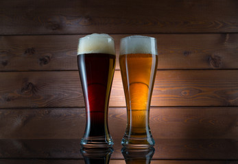 Two glasses of different colored beer