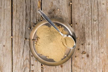 Portion of White Pepper on wooden background, selective focus