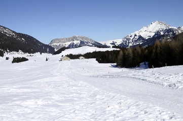 Fototapeta na wymiar Snow landscape and ski trails on Glieres, Savoy, France